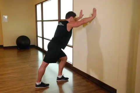 Calf Stretch Hands Against Wall
