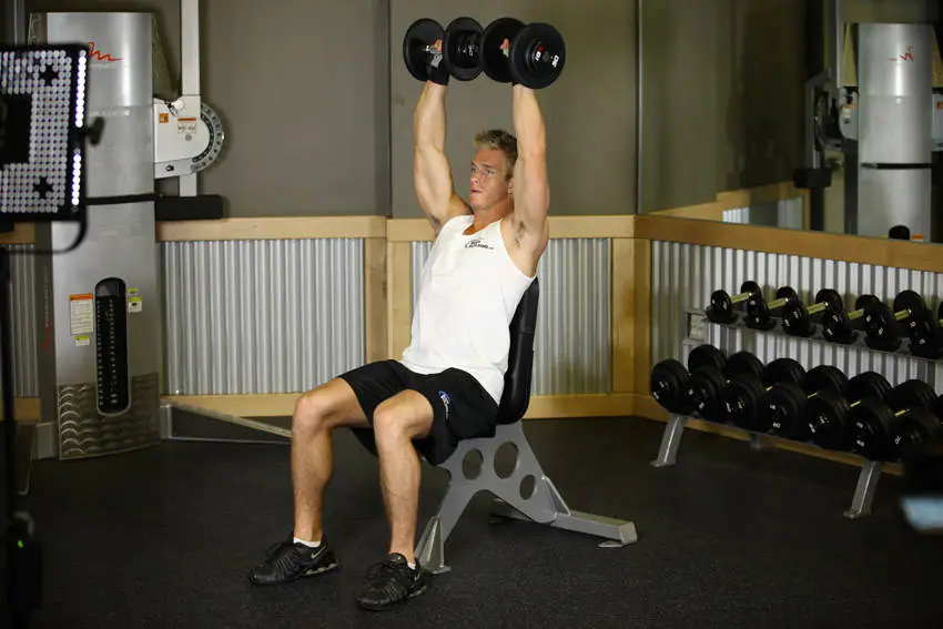 Dumbbell Shoulder Press — posisi akhir