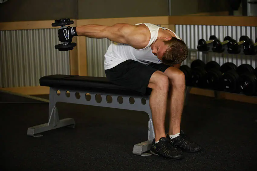 Seated Bent-Over One-Arm Dumbbell Triceps Extension — posisi akhir