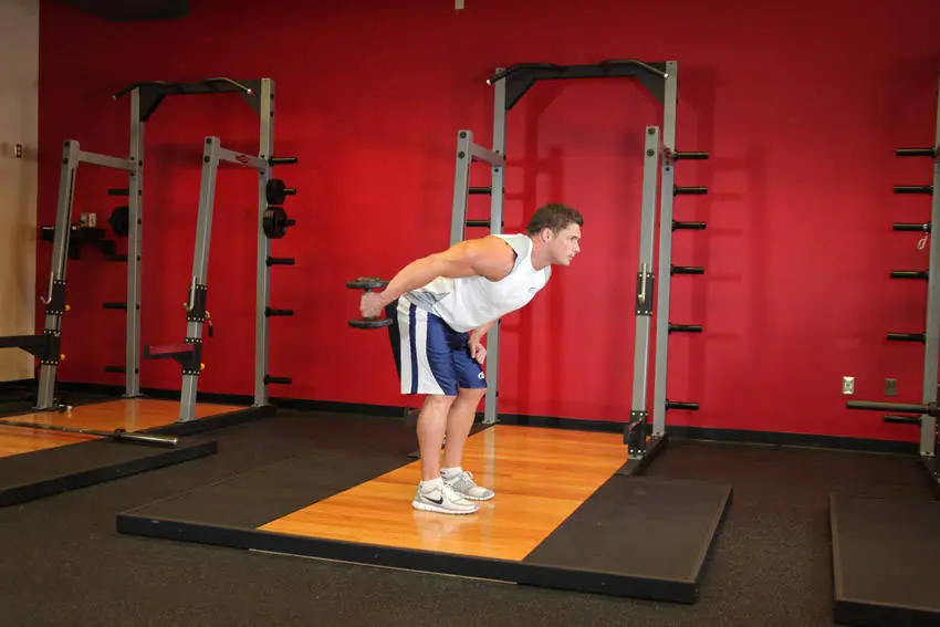 Standing Bent-Over One-Arm Dumbbell Triceps Extension — posisi akhir